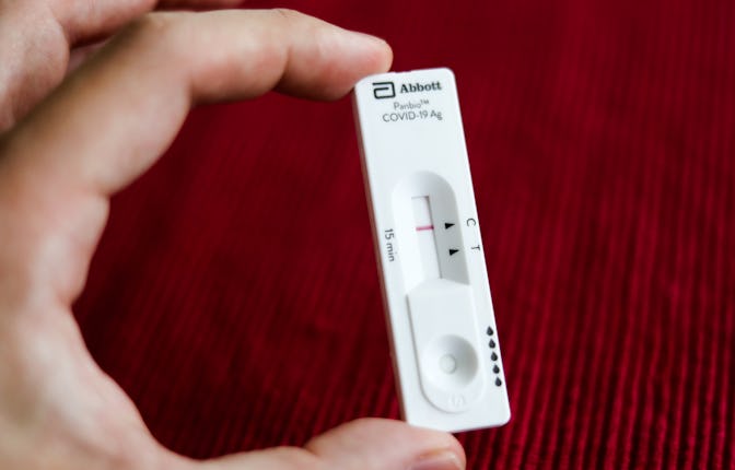 A negative result of Abbott Panbio COVID-19 antigen self-test is seen in this illustration photo tak...