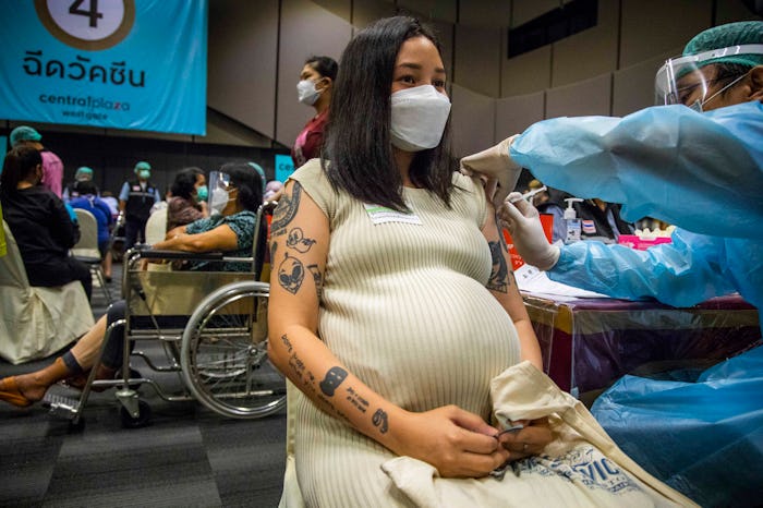 BANGKOK, THAILAND - AUGUST 30: A pregnant woman receives her first dose of the Pfizer Vaccine at Cen...