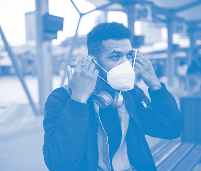 Young African - American on the way to work, sustainable lifestyle.