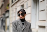 PARIS, FRANCE - NOVEMBER 26: Katie Giorgadze @katie.one wears black sunglasses, a black ribbed wool ...