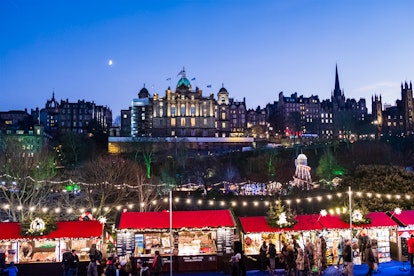 People at the Christmas Market set up in the Princes Street Gardens in downtown Edinburgh.