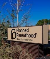 Planned Parenthood clinic entrance showing entry sign and building, This clinic is in Pullman Washin...