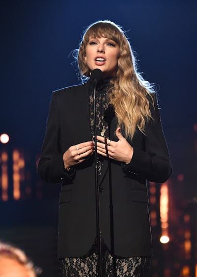 Taylor Swift wears a lacy, black dress onstage during the 36th Annual Rock & Roll Hall Of Fame Induc...