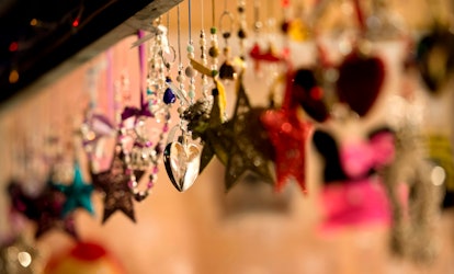 Festive decorartions are displayed for sale on a stall in the 'St Nicholas Fair' Christmas market in...