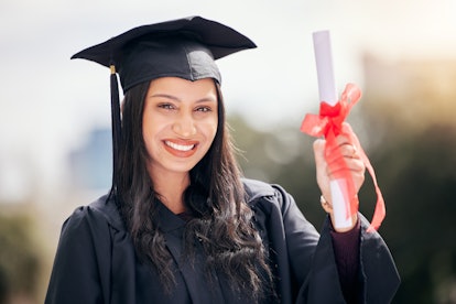 Woman with her diploma graduating college