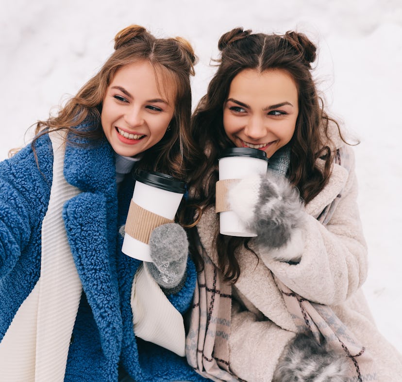 Two happy friends during winter use January quotes and January photo captions as captions for Instag...