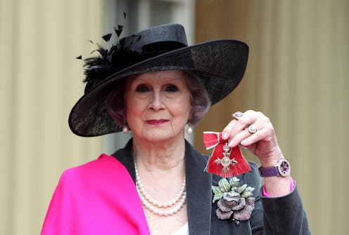 April Ashley holds her Member of the British Empire (MBE) medal which was awarded to her by Queen El...