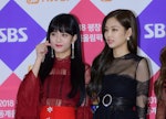 Jisoo and Jennie of BLACKPINK attend the 2017 SBS 'Battle of the Bands' wearing red and black outfit...