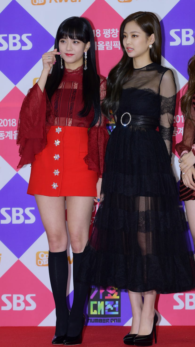 Jisoo and Jennie of BLACKPINK attend the 2017 SBS 'Battle of the Bands' wearing red and black outfit...