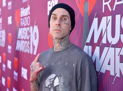 Someone hated on Travis Barker's tattoos and he had a perfect response.