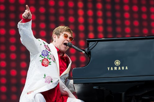 Elton John performs live on the piano.