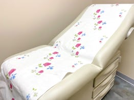 standard patient examination chair in medical office