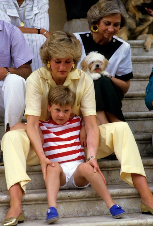 PALMA, MAJORCA - AUGUST 10: Diana, Princess of Wales, wearing a yellow jumpsuit, sits on the steps o...