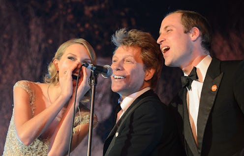 Britain's Prince William, Duke of Cambridge, (R) sings with US singers Jon Bon Jovi (C) and Taylor S...
