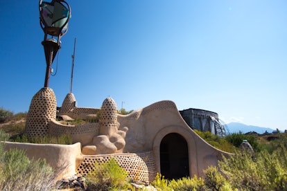 Taos, NM: An Earthship house in the Earthship BioTecture near Taos, NM. Designed by architect Michae...