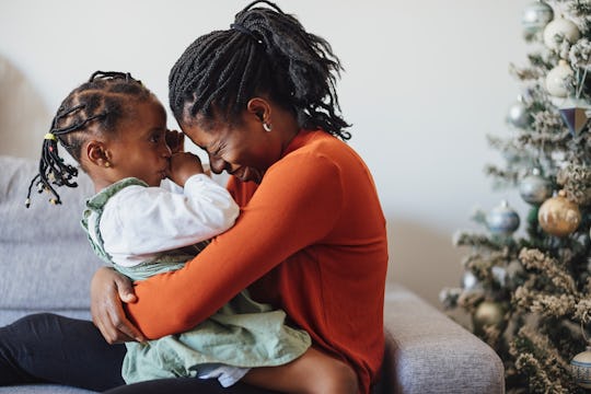 mom and daughter laughing during the holidays