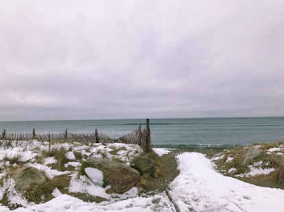 A snow path leads to the Oceanside in WEEKAPAUG, where there is a feeling of solitude.