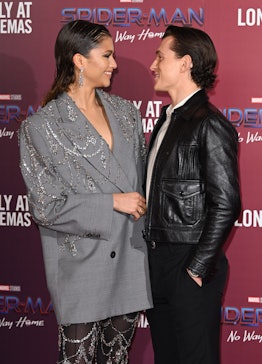 Zendaya and Tom Holland looking at each other at a photocall for "Spiderman: No Way Home" 