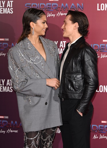Zendaya and Tom Holland attend a photocall for "Spiderman: No Way Home" 