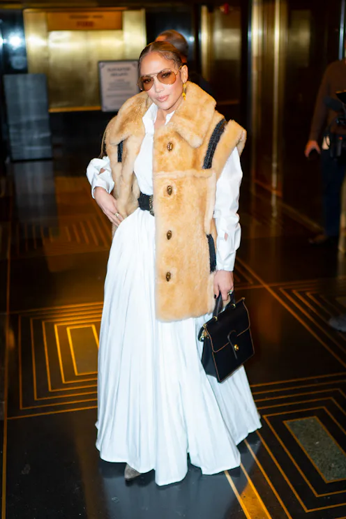 Jennifer Lopez wearing a furry vest.