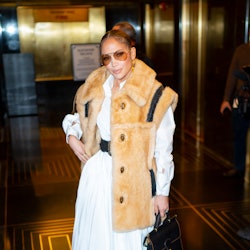 Jennifer Lopez wearing a furry vest. 