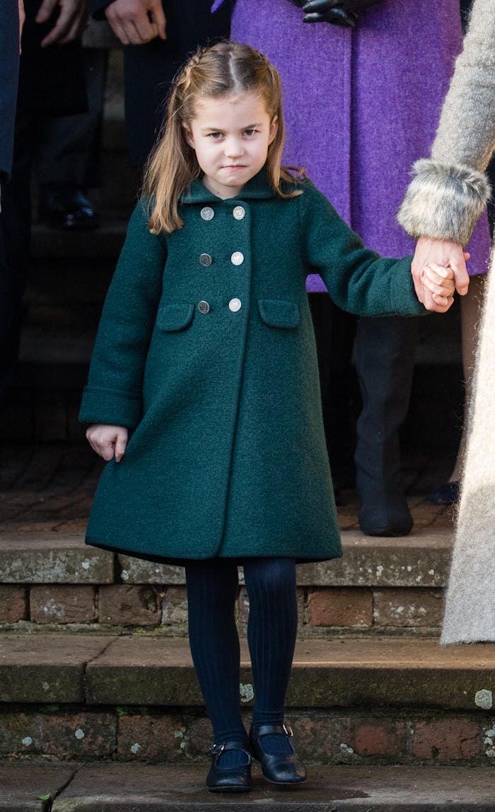 KING'S LYNN, ENGLAND - DECEMBER 25: Princess Charlotte of Cambridge is given a hug by a wellwisher a...