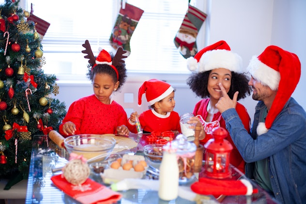 Family baking cookies for Christmas together