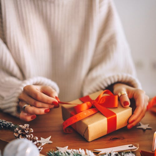 Woman wrapping Christmas gifts