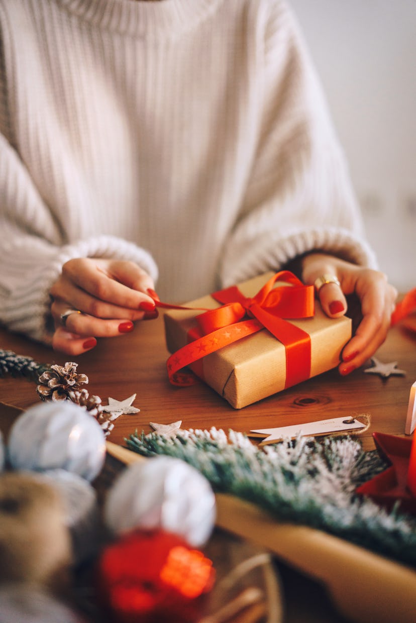 Woman wrapping Christmas gifts