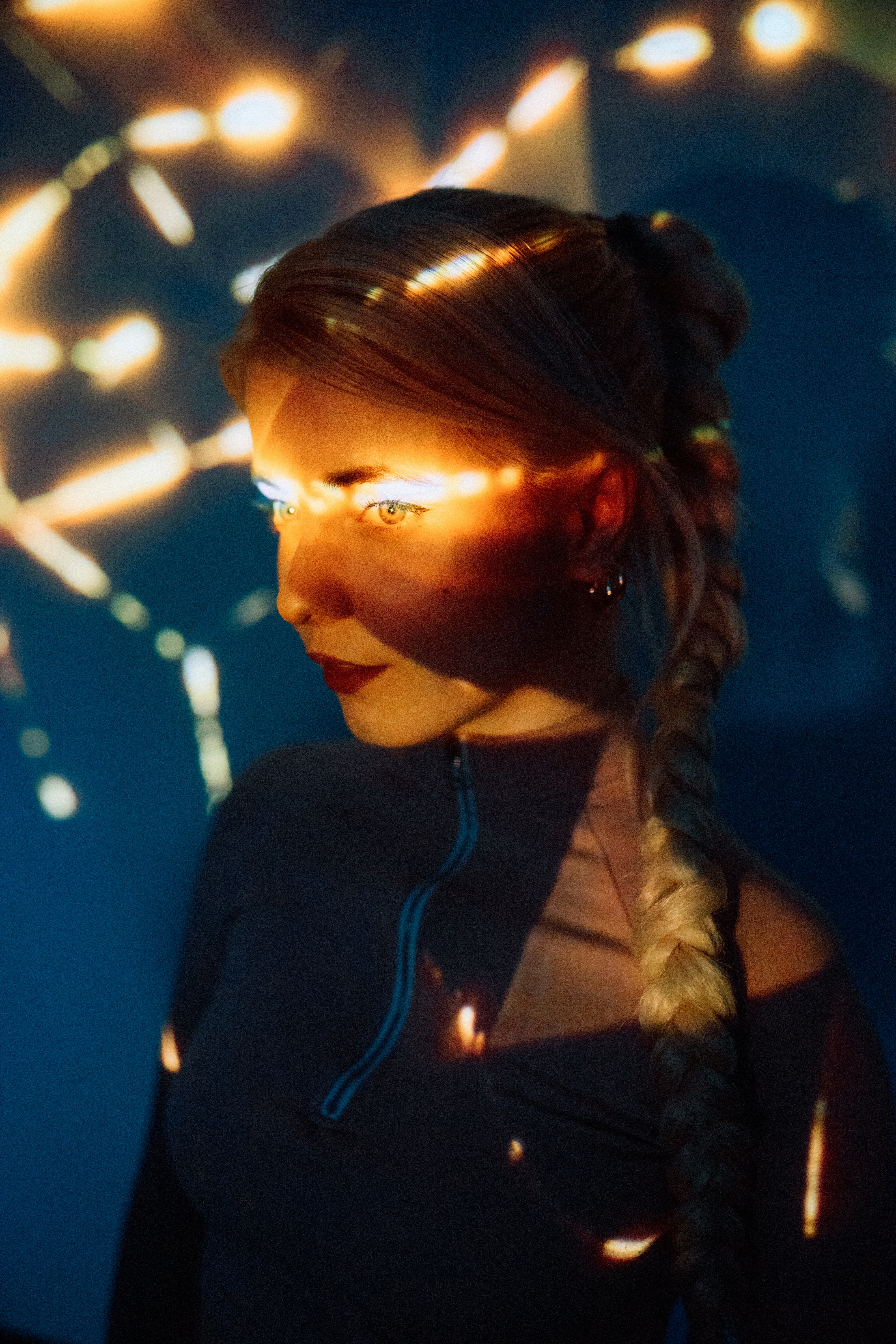 Young woman thinking about how the January 2022 new moon will affect her zodiac sign.