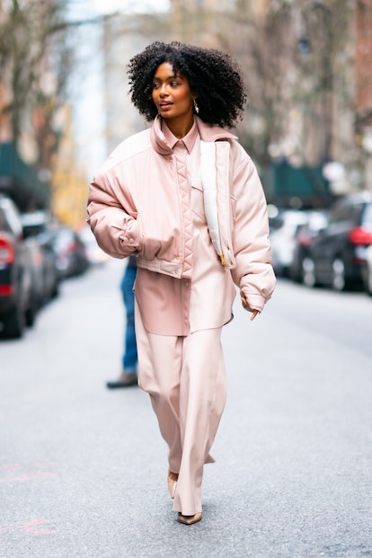 Yara Shahidi wearing a color block jacket from Nanushka. 