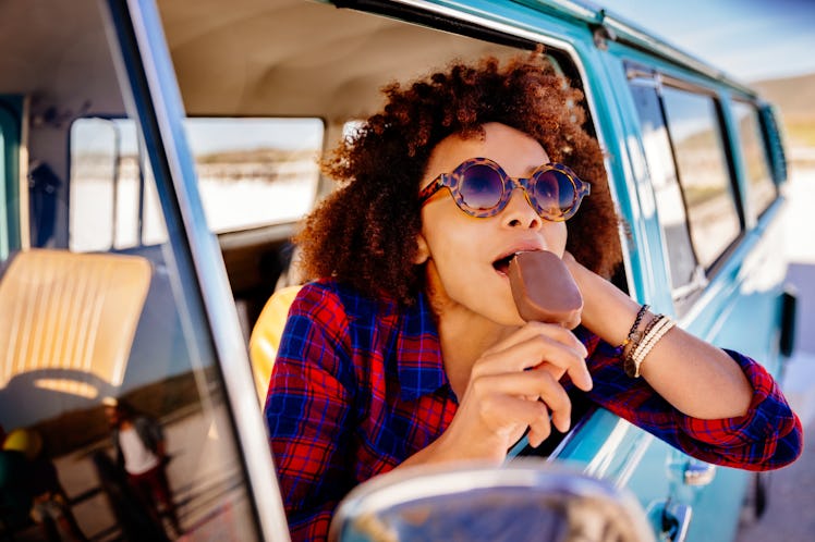 A girl with ice cream on a road trip is the aesthetic you'll want for travel trends in 2022, accordi...