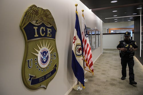 WASHINGTON, DC - MAY 11: A law enforcement officer walks past ICE logo ahead of a press conference o...