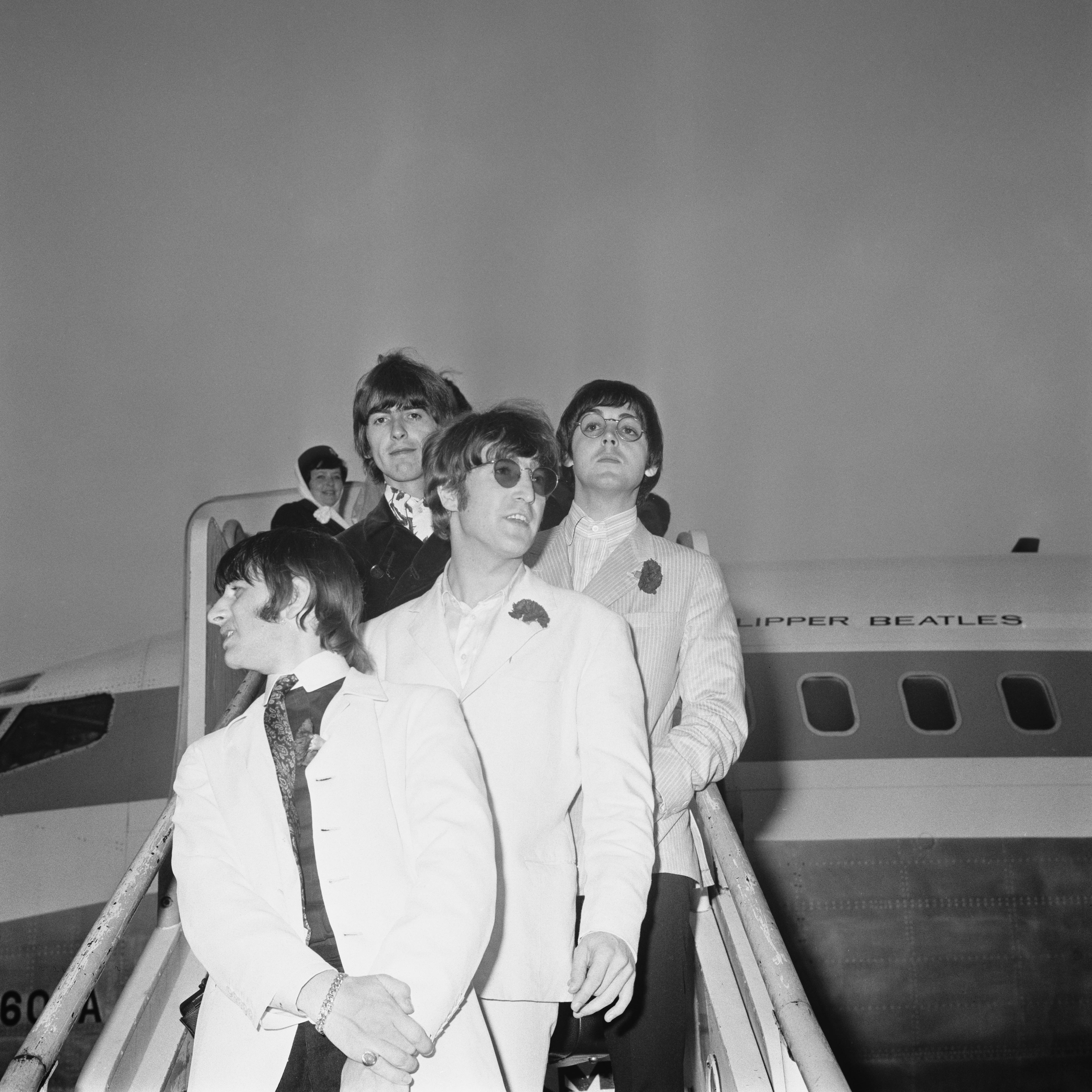 British rock group the Beatles arrive at London Airport on the 'Clipper Beatles', after their final ...