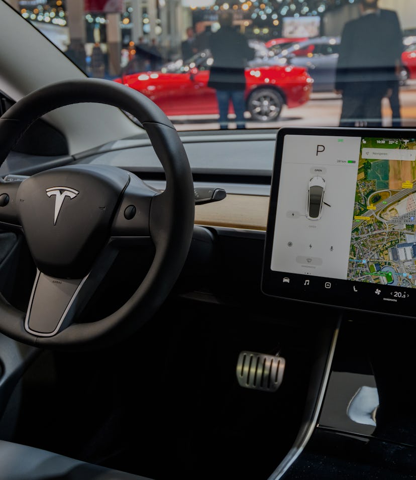 BRUSSELS, BELGIUM - JANUARY 09: Tesla Model 3 compact full electric car interior with a large touch ...