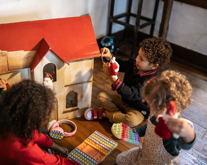 Siblings playing at home