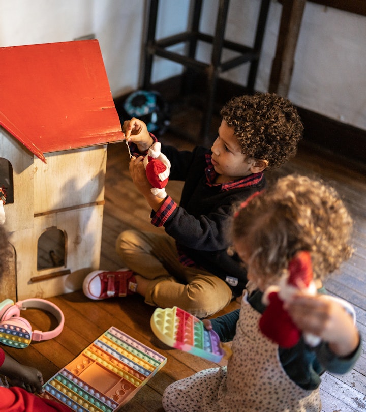 Siblings playing at home