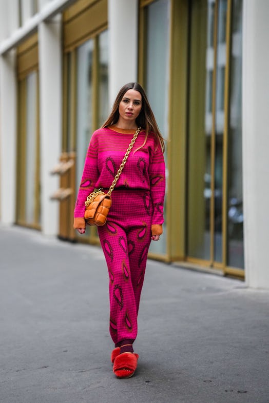 Maria Rosaria Rizzo wears a neon pink and striped knit set.