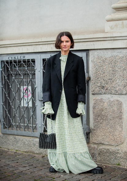 COPENHAGEN, DENMARK - JANUARY 29: Marta Cygan seen wearing blazer, green dress, bag outside Helmsted...
