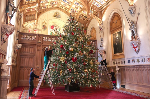 Queen Elizabeth lets her grandchildren help decorate the tree.