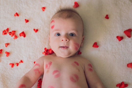 baby with hearts and kiss marks 