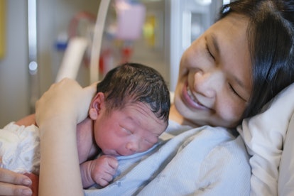 new mom holding newborn baby