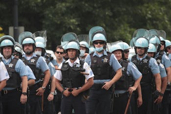 A group of Chicago police officers wearing riot gear.