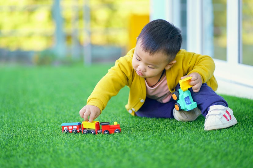 Toddlers love trains, cars, and other wheeled toys because they are familiar objects to them.
