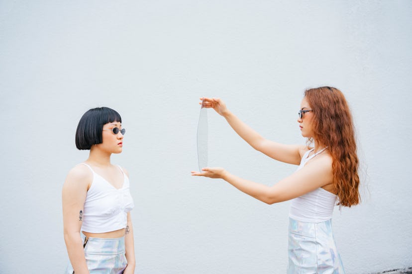 Two women on a photo set experiencing face blindness