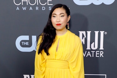 Awkwafina hits the red carpet in a yellow dress.