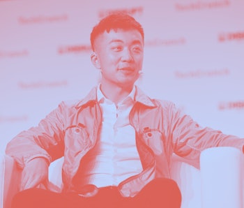 Carl Pei seated on stage at the TechCrunch Disrupt conference.