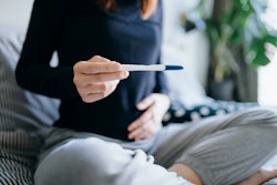 woman looking at pregnancy test, what if the line vanishes