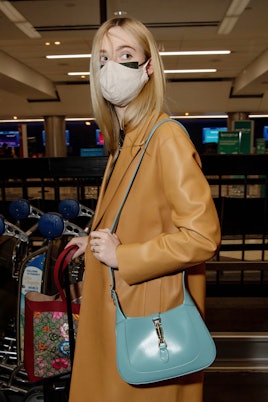 Elle Fanning is seen at LAX airport on October 30, 2020 in Los Angeles, California. 