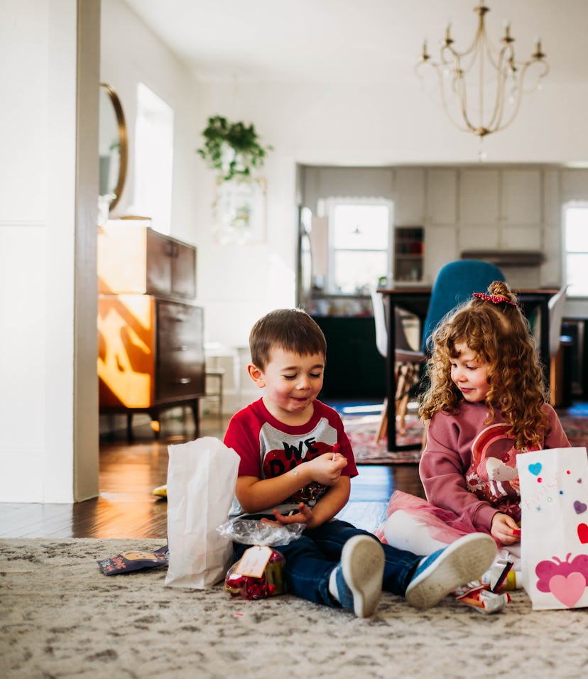 kids going through their bags of valentines from school